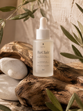ReClair skincare serum bottle on a wooden surface with natural elements