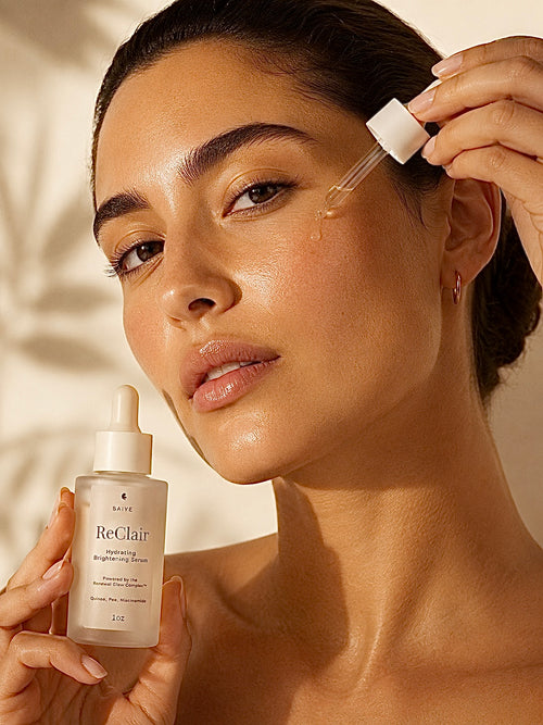 Woman applying skincare product with ReClair dropper bottle against a neutral background